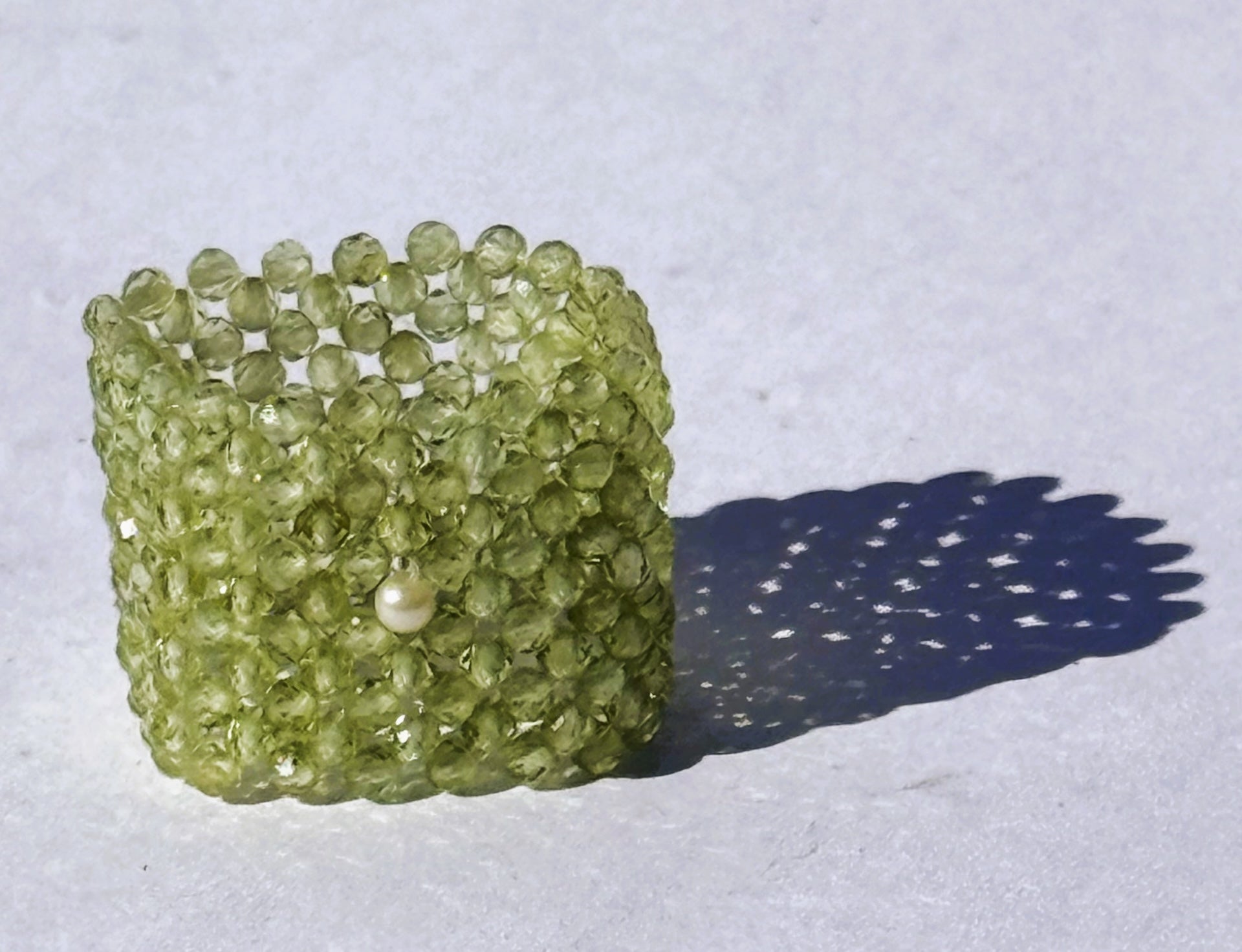 Peridot ring with natural pearl detail