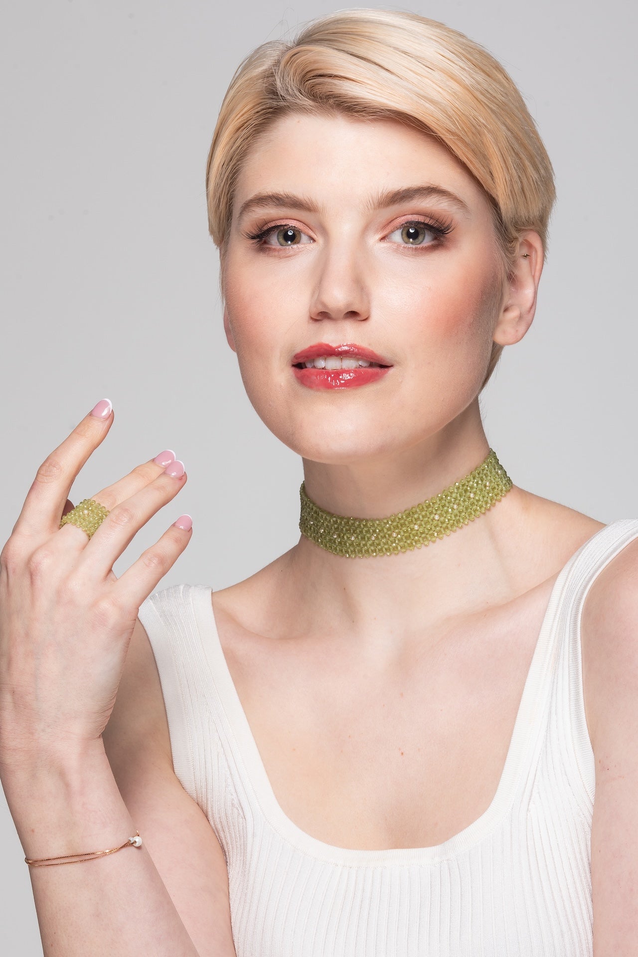 Peridot ring with natural pearl detail