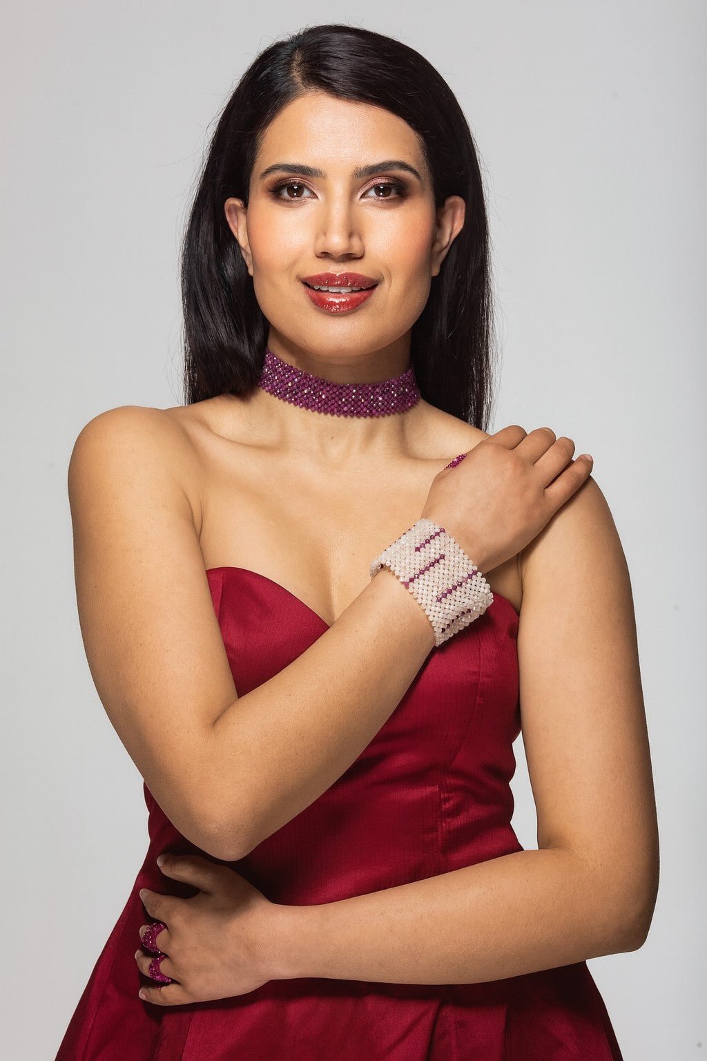 Model wearing ballgown with Rose quartz and ruby Gemstone Cuff | Handmade by Carla Ciminera